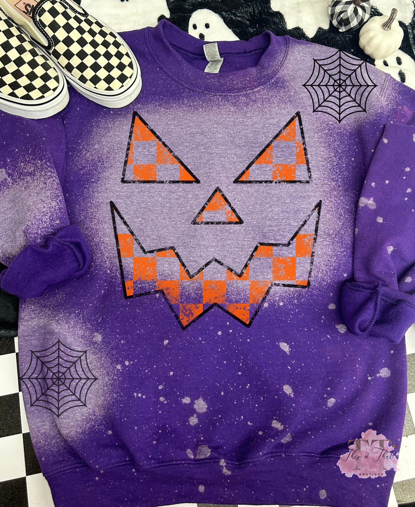 Jack O Lantern on a Bleached Purple Sweatshirt